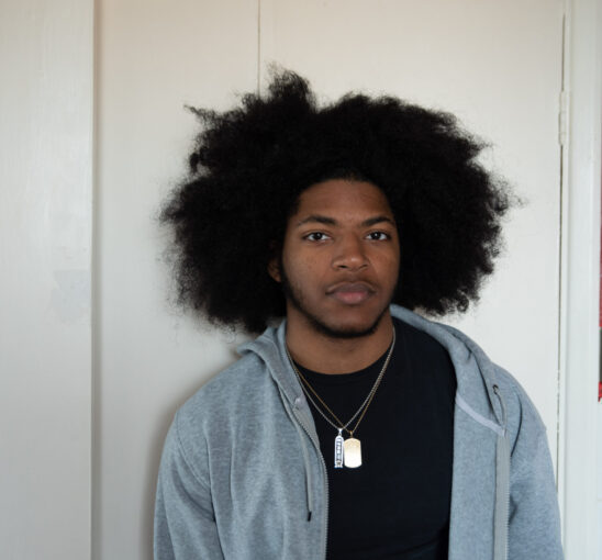 Young man stood in a kitchen