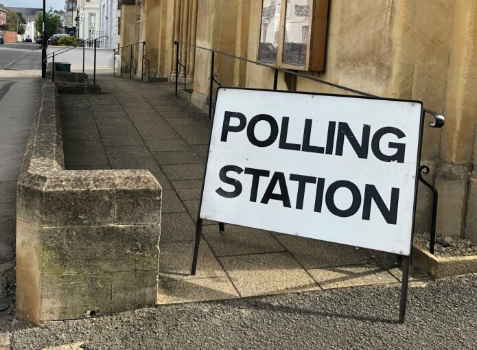 Polling station sign to vote