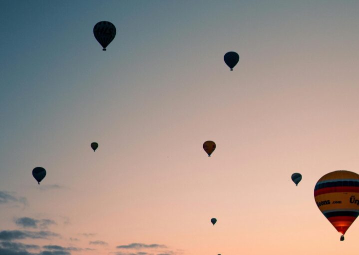 Stock photo of hot air balloons over sunset