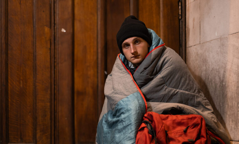 Jamie sat in a church doorway