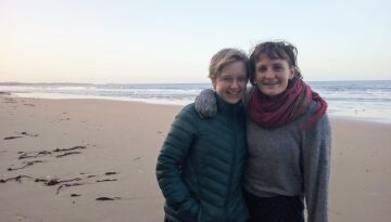 Hannah and Clare, volunteer hosts on the beach