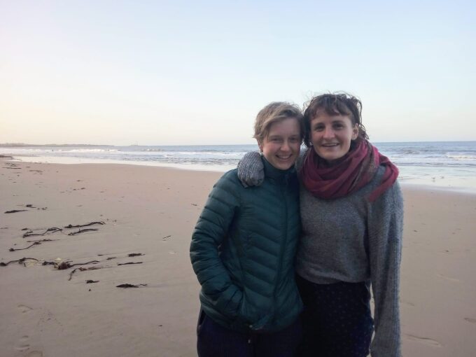 Hannah and Clare, volunteer hosts on the beach